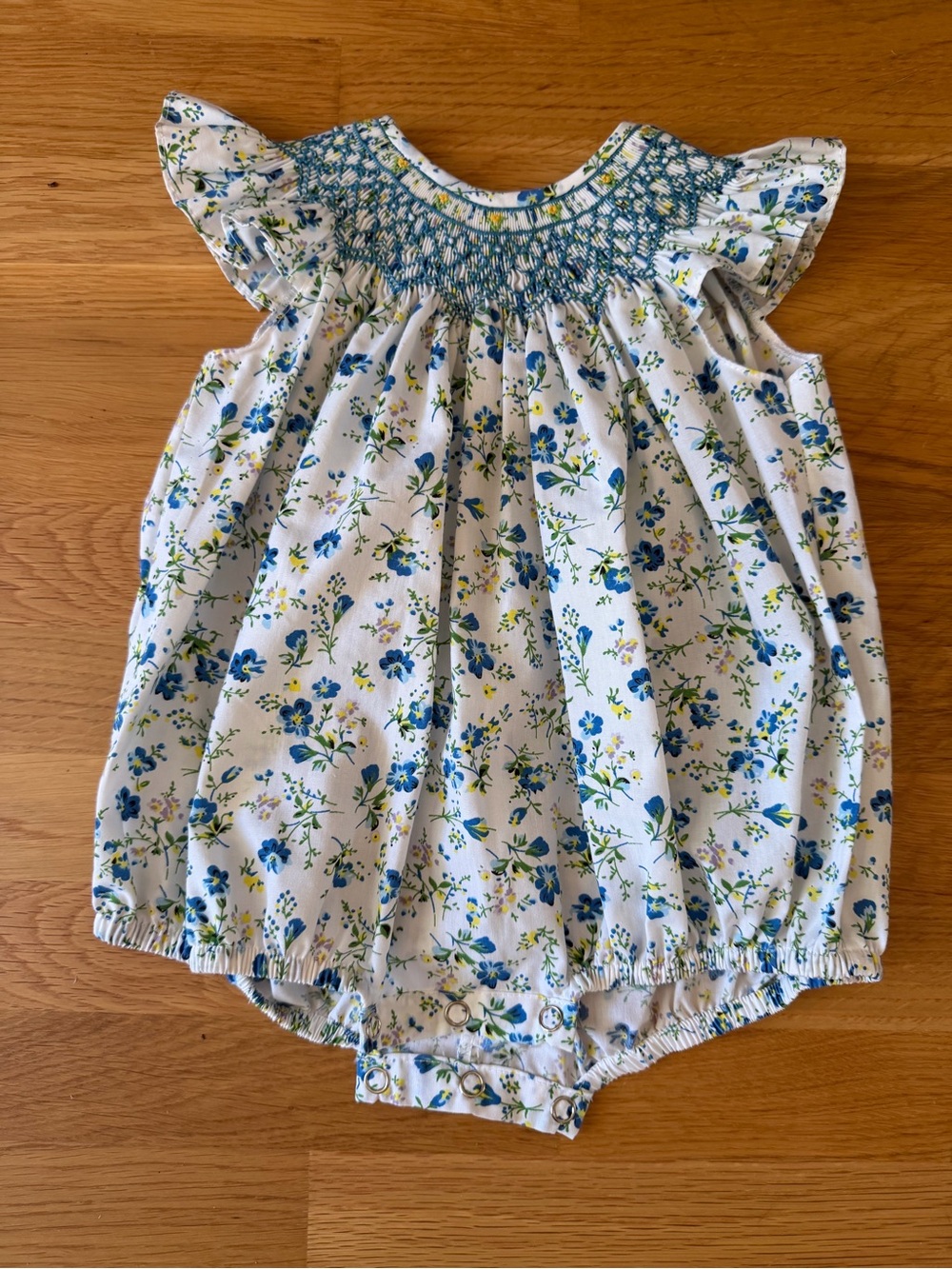 White Floral Smocked Baby Romper with Blue and Green Flowers